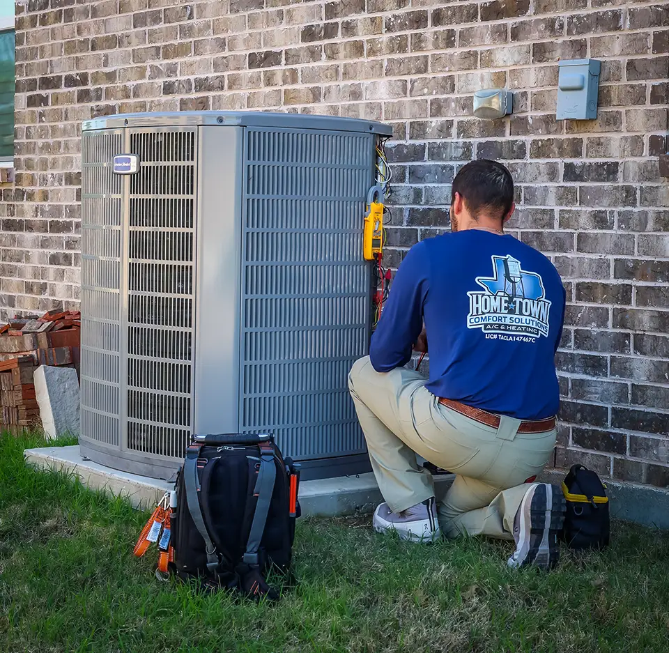 Brandon performs a diagnostic check on an air conditioner.