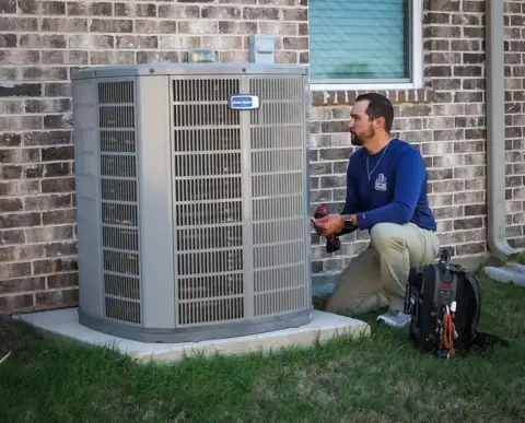Brandon fixes a customer's American Standard Air Conditioner.
